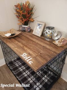 a wooden table with metal wire baskets and flowers on top, along with other items