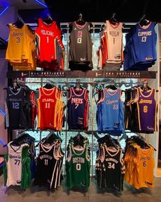 basketball jerseys are on display in a store