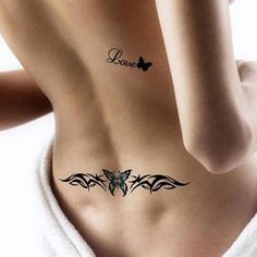 a woman with a tattoo on her stomach