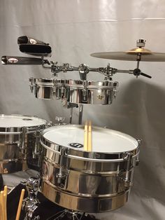 a drum set with sticks in front of it