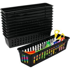 black plastic bins with scissors and other items in them