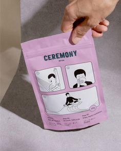 a person holding up a pink bag with instructions on how to use it