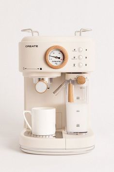 a white coffee maker sitting on top of a counter