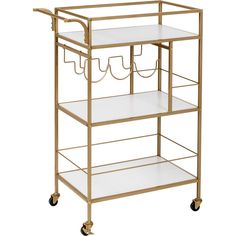 a gold and white serving cart with three shelves