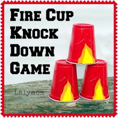 three red cups with yellow flames on them and the words fire cup knock down game