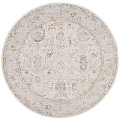 a round rug with an ornate design on the center and bottom in grey, beige and gold