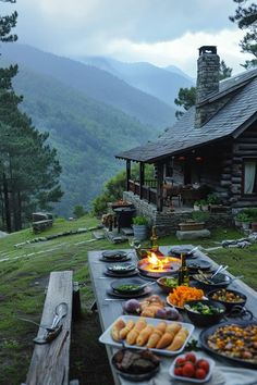 a table with food on it in front of a cabin