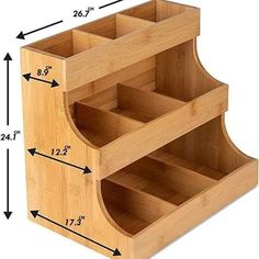 a wooden organizer with three compartments and measurements for each section on the bottom half of it