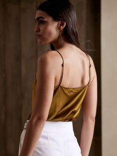 An indulgent, elegant essential, this versatile camisole is crafted from our washable silk charmeuse and cut on the bias for figure-flattering drape.  SEMI-FITTED: Cut for a not-too-tight, not-too-loose fit.  V-neck.  Adjustable slider straps.  Dolph Luxury Fitted Camisole With Built-in Bra, Luxury Silk V-neck Camisole, Silk Cami Tank Top With Built-in Bra, Silk Cami Top With Built-in Bra, Silk Camisole With Built-in Bra, Silk Camisole With Built-in Bra And Spaghetti Straps, Elegant Solid Color Cami Tank Top, Silk Tank Top With Built-in Bra For Night Out, Solid Color Satin Camisole For Night Out