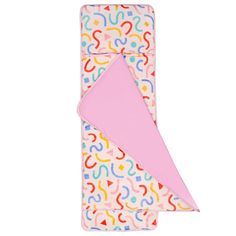 a pink blanket with colorful shapes on it