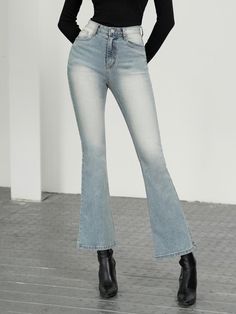 The garment shown is a pair of jeans with a flared silhouette, which creates a bell-shaped look towards the hem. They have a faded wash effect on the thighs and seat, which gives them a worn and casual appearance. The jeans are fitted with a contoured waistband that is designed to sit smoothly around the hips. The visible stitching is done in a thread that offers a subtle contrast to the fabric, providing a classic denim aesthetic.- The faded wash effect adds dimension and a sense of lived-in comfort to the jeans, suggesting a casual, everyday style.- The flared legs give a nod to vintage fashion trends while offering a contemporary twist to modern wardrobes.- With a smooth waistband, these jeans are likely to provide a snug fit without gapping at the back, ensuring both style and comfort. Denim Blue Flare Jeans With Five Pockets, Denim Flares With Five Pockets, Light Wash Flare Jeans For Fall, Faded Flare Bottoms For Fall, Flare Light Wash Jeans For Fall, Fall Light Wash Flare Jeans, Casual Medium Wash Flare Jeans With Flared Hem, Casual Medium Wash Flare Jeans, Casual Blue Flares With Flared Hem