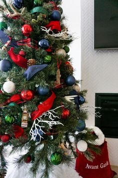 a christmas tree decorated with ornaments and stockings