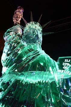 the statue of liberty is made out of ice and has a crown on it's head