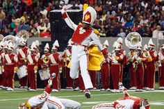 a marching band is performing on the field