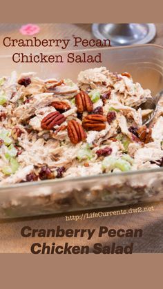 a casserole dish with chicken salad and pecans in it on a table