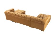 a brown couch sitting on top of a white floor