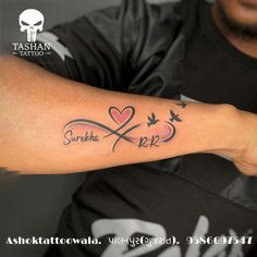 a man with a tattoo on his arm and the word love is written in arabic