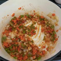 the food is being cooked in the pot on the stove