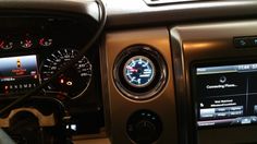 the dashboard of a vehicle with various gauges and instruments on it's display