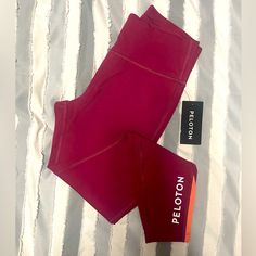 Nwt Peloton Leggings 23.5 Inch Inseam, Mid Rise. Cranberry Color With Bright Orange Ribbed Accents. Stash Pocket In The Back Inside Of The Leggings. It Also Has An Adjustable Drawstring Inside Peloton Leggings, American Flag Sweater, Adidas Track Suit, Cranberry Color, Compression Pants, People Shopping, Grey Leggings, Seamless Leggings, Steel Blue