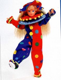 the doll is wearing a colorful clown outfit