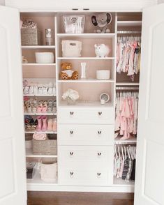 a white closet filled with lots of baby items