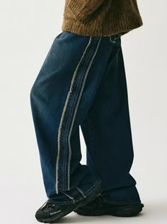 These wide denim pants feature unique fringed raw-edge detail along sides and back pockets, and brush washing. They're made from seasonless 13.05oz cotton denim and neatly finished with durable sewing and rivets.- Zip and logo-engraved button fastening  - Five pockets- Raw edge fringe detail at side and back pocket- Logo leather label at back- Bursh washing- High quality sewing finish (double stitch and chain stitch)- Wide fit - Unisex wear Urban Denim Pants With Frayed Hem, Urban Style Wide Leg Jeans With Frayed Hem, Streetwear Dark Wash Flare Jeans With Frayed Hem, Urban Wide-leg Jeans With Frayed Hem, Urban Style Dark Wash Bottoms With Frayed Hem, Urban Wide Leg Jeans With Frayed Hem, Urban Dark Wash Bottoms With Frayed Hem, Urban Bottoms With Frayed Hem In Dark Wash, Dark Wash Flare Jeans With Frayed Hem For Streetwear