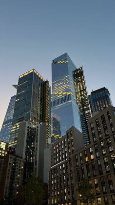 skyscrapers lit up at night in the city