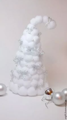 a white christmas tree made out of balloons