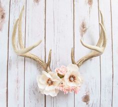 an antlers head with flowers on it and the words dear magnana written in pink