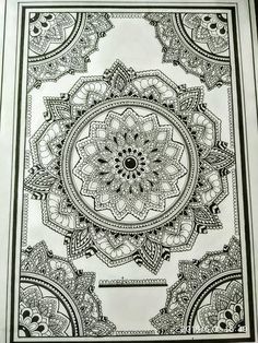 an intricate black and white drawing on paper