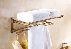 a towel rack with two towels hanging on it