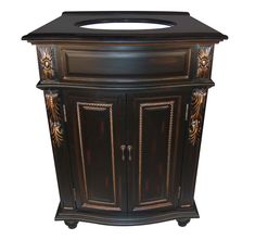 an ornate wooden cabinet with black top and gold trimmings on the front door