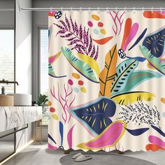 a bathroom with a shower curtain that has colorful flowers and leaves on it, along with a bathtub