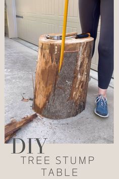 a woman is standing next to a tree stump with a yellow pole in it and the words diy tree stump table