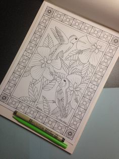 a coloring book with birds and flowers on it