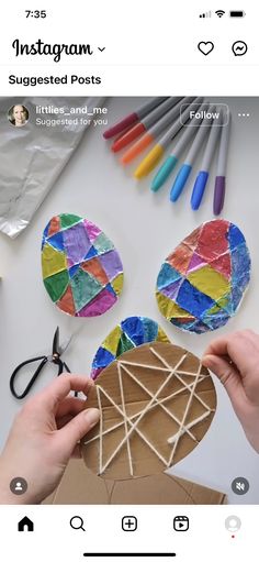 someone is making an ornament out of colored paper