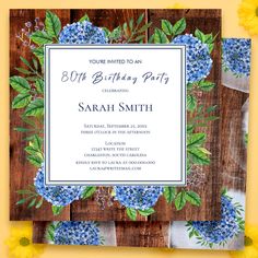 a birthday party card with blue flowers and green leaves on wooden planks, surrounded by yellow daisies