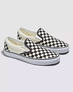 Introduced in 1977, the Vans #98, now known as the Classic Slip-On is a Southern California icon and everyday essential. This Checkerboard Classic Slip-On Shoe in Black/White includes a low profile canvas upper, supportive padded collar, elastic side accent, and out signature rubber waffle outsoles. Vans Checkerboard Outfit, Dark Blue Office, Checkered Vans Outfit, Check Vans, Vans Checkerboard Slip On, White Checkered Vans, Checkerboard Vans, Checkered Shoes, Vans Checkered