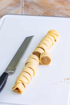 a knife and some food on a cutting board