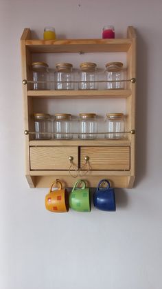 a wooden shelf filled with cups and containers