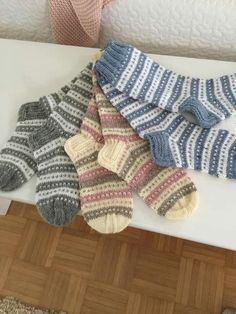 several pairs of socks sitting on top of a table