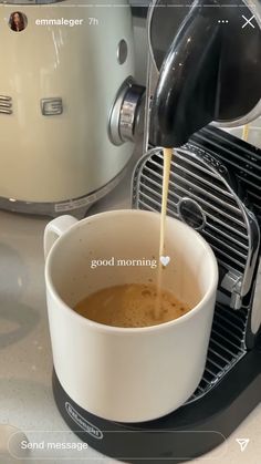 coffee being poured into a cup in front of an espresso machine with the words good morning written on it