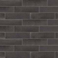 a dark grey brick wall with no mortars