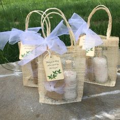 three bags filled with candles sitting on top of a table