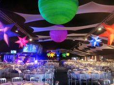 the ceiling is decorated with stars and balloons