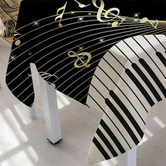 a black and white table cloth with musical notes on it