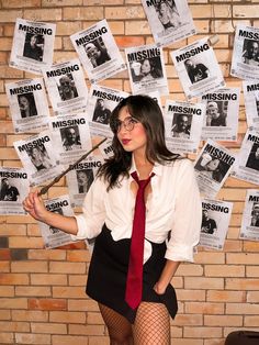 a woman in tights and stockings posing for a photo with missing posters on the wall behind her