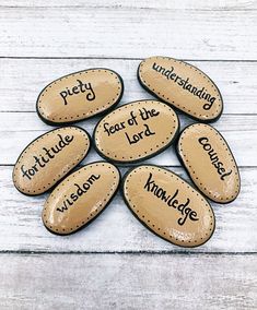 six stones with words written on them that spell out the word, pety, and heart of the lord