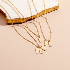 Initial pendants make such special statements, and our Madeline Rectangle Three Initial Pendant is one of our faves. Choose three initials to add to our petite disc necklace. Makes the perfect gift for your fave momma or BFF. 1/2" x 1/4" gold filled or sterling silver tag Hand stamped initial 16" brass satellite chain with 2" extender Lobster claw closure Made in the USA With customization this item is FINAL SALE NOTE - discs DO NOT slide on and off the chain. If you are looking to add or remove Trendy Necklaces, Disc Necklace, Custom Initials, Slide On, Initial Pendant, Personalized Necklace, Beautiful Packaging, Jump Rings, Lobster Claw